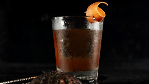 High-end craft cocktail isolated on a clean background, elegantly presented in a premium glass